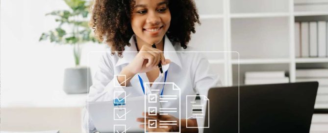 Smiling woman in a white shirt reviewing documents and engaging with a laptop, symbolizing digital marketing and customer feedback strategies.